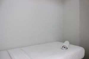 Spacious 2BR Apartment at Pinewood near JATOS By Travelio
