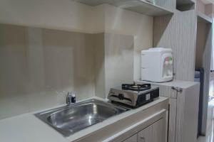 Relax Studio at Vida View Makassar Apartment By Travelio