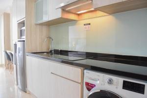 Fully Furnished with Cozy Design Studio at Menteng Park Apartment By Travelio