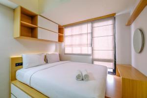 Best Deal and Tidy Studio at Evenciio Margonda Apartment By Travelio