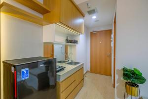 Best Deal and Tidy Studio at Evenciio Margonda Apartment By Travelio