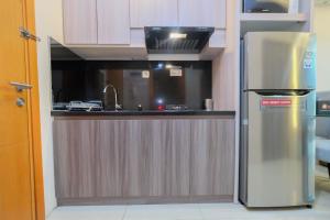 Modern and Comfy 1BR Apartment at Woodland Park Residence By Travelio