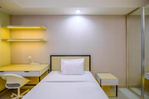 Comfy and Minimalist Studio at Evenciio Margonda Apartment By Travelio