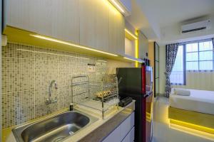 Comfy and Minimalist Studio at Evenciio Margonda Apartment By Travelio