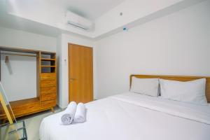 Comfort 1BR Apartment at Evenciio Margonda By Travelio