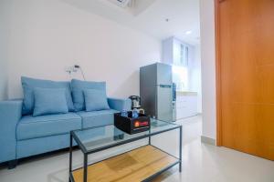Comfort 1BR Apartment at Evenciio Margonda By Travelio