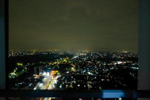 Comfort 1BR Apartment at Evenciio Margonda By Travelio