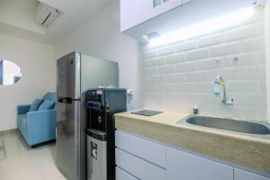 Comfort 1BR Apartment at Evenciio Margonda By Travelio