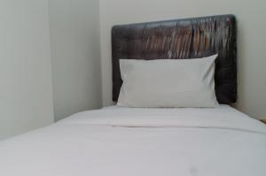 Spacious and Homey 2BR at Asatti Apartment By Travelio