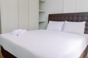 Spacious and Homey 2BR at Asatti Apartment By Travelio