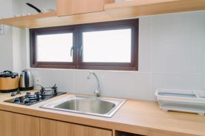 Spacious and Homey 2BR at Asatti Apartment By Travelio