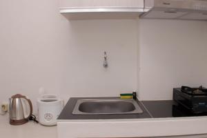 Cozy Living Studio at Urbantown Apartment Karawang By Travelio