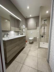 Appartements Appart du faubourg : photos des chambres