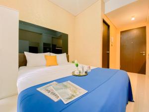 Homey and Comfort Living Studio Apartment Transpark Cibubur By Travelio