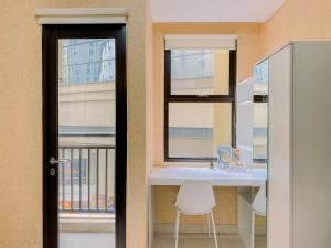 Homey and Comfort Living Studio Apartment Transpark Cibubur By Travelio