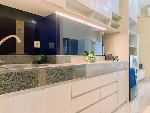 Homey and Comfort Living Studio Apartment Transpark Cibubur By Travelio