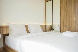 Fully Furnished and Tidy 2BR at Sky House BSD Apartment By Travelio