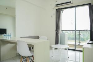 Fully Furnished and Tidy 2BR at Sky House BSD Apartment By Travelio