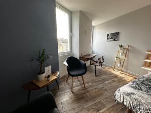 Appartements Appart du faubourg : photos des chambres