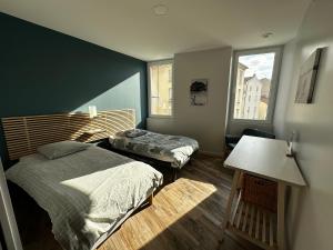 Appartements Appart du faubourg : photos des chambres