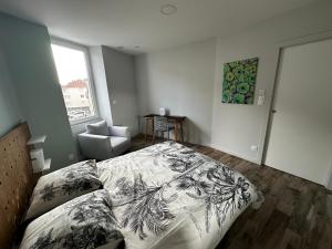 Appartements Appart du faubourg : photos des chambres