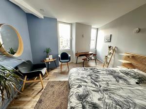 Appartements Appart du faubourg : photos des chambres