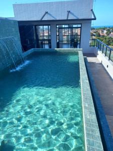 Apto completo em Cabedelo, proximo a João Pessoa com 2 quartos, cozinha completa e ar condicionado e varanda Gourmet