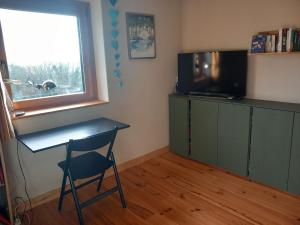 Maisons de vacances Maison en bois a la campagne proche vilaine : photos des chambres