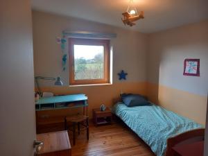 Maisons de vacances Maison en bois a la campagne proche vilaine : photos des chambres