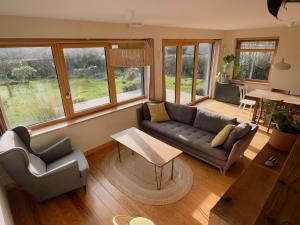 Maisons de vacances Maison en bois a la campagne proche vilaine : photos des chambres