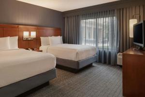 Suite with Two Double Beds and Sofa Bed room in Courtyard Anaheim Buena Park