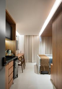 Loft com hidromassagem frente mar e pé na areia