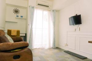 Nice and Homey 1BR at Serpong Greenview Apartment By Travelio