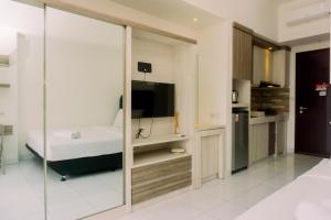 Elegant and Nice Studio Casa De Parco Apartment near ICE BSD By Travelio