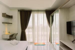 Elegant and Nice Studio Casa De Parco Apartment near ICE BSD By Travelio