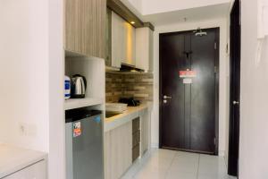 Elegant and Nice Studio Casa De Parco Apartment near ICE BSD By Travelio
