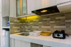 Elegant and Nice Studio Casa De Parco Apartment near ICE BSD By Travelio