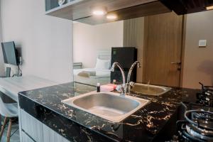 Simply and Comfortable Studio Apartment B Residence By Travelio