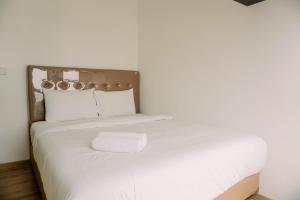 Comfort and Modern Look 2BR Apartment M-Town Signature By Travelio