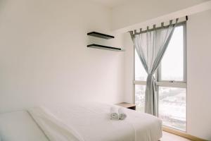 Comfort and Modern Look 2BR Apartment M-Town Signature By Travelio