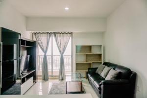 Comfort and Modern Look 2BR Apartment M-Town Signature By Travelio
