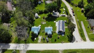 Fun Place with a Sandy Beach for Swimming, Boating & Fishing, Featuring 1 House and 3 Cabins