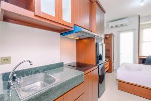 Fancy and Nice Studio Apartment at Transpark Cibubur By Travelio