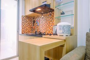 Minimalist and Cozy Living 2BR at Bassura City Apartment By Travelio