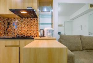 Minimalist and Cozy Living 2BR at Bassura City Apartment By Travelio