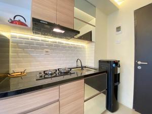 Cozy Designed Studio Apartment at Grand Asia Afrika By Travelio