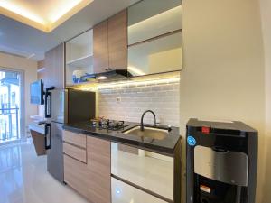 Cozy Designed Studio Apartment at Grand Asia Afrika By Travelio