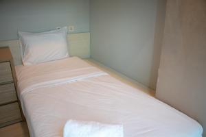 Nice and Homey 2BR Apartment at Capitol Park Residence By Travelio