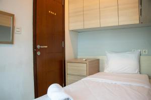 Nice and Homey 2BR Apartment at Capitol Park Residence By Travelio