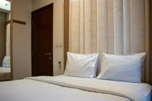 Nice and Homey 2BR Apartment at Capitol Park Residence By Travelio